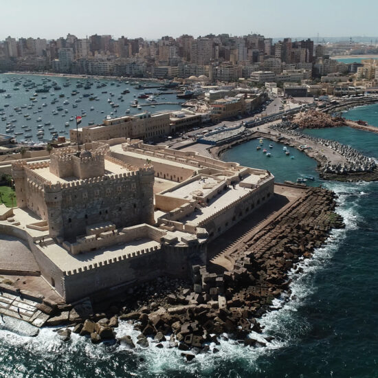 Aerial Drone shot over Egypt Alexandria City sea The Citadel of Qaitbay
