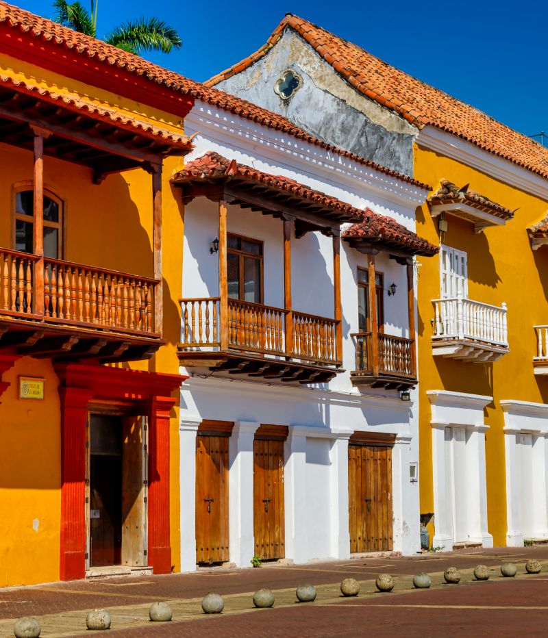 Bicycle parked at the entrance to a traditional building in Cartagena de Indias, Colombia