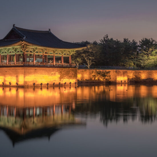 Landscape of the Donggung Palace and Wolji Pond surrounded by lights in the evening in South Korea