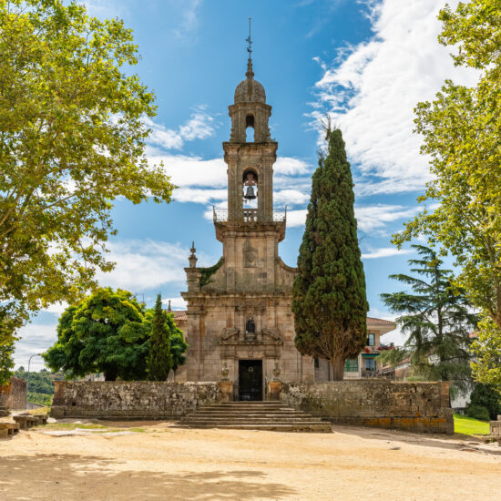 Slender old stone church in the monumental village of Allariz, Orense, Galicia.