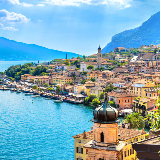 Beautiful village Limone Sul Garda on Garda Lake. The most famous tourist destination on lake. Aerial view. Lombardy, Italy.