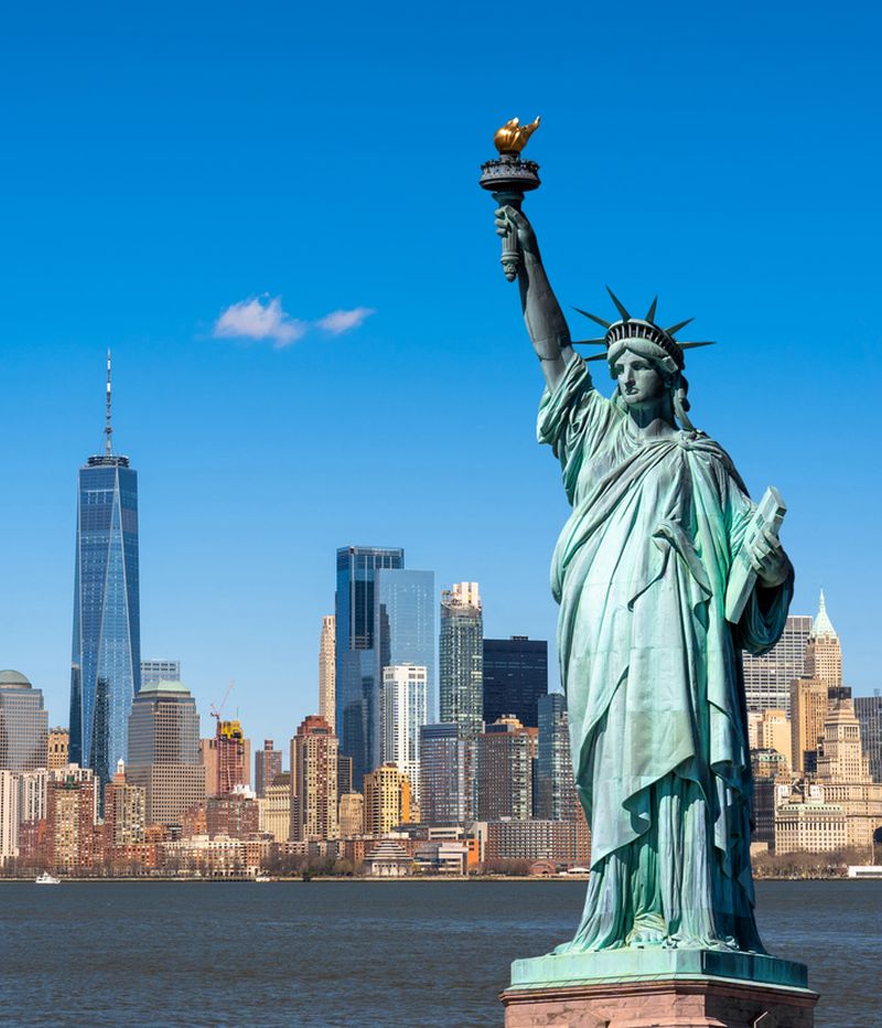 The Statue of Liberty over the Scene of New york cityscape river side which location is lower manhattan,Architecture and building with tourist concept