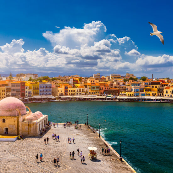 Mosque in the old Venetian harbor of Chania town on Crete island, Greece. Old mosque in Chania. Janissaries or Kioutsouk Hassan Mosque in Chania Crete. Turkish mosque in Chania bay. Crete, Greece.