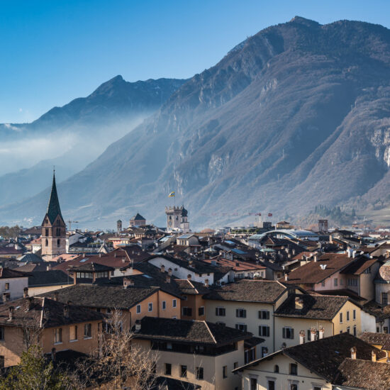 Scenic view of Trento, framed by the Alps in the background in Trentino region, Italy