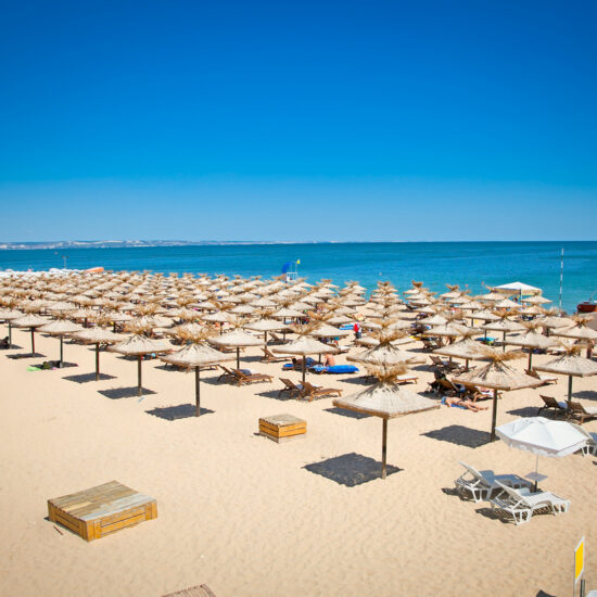 View of seaside umbrellas lined up on Varna Beach, Bulgaria