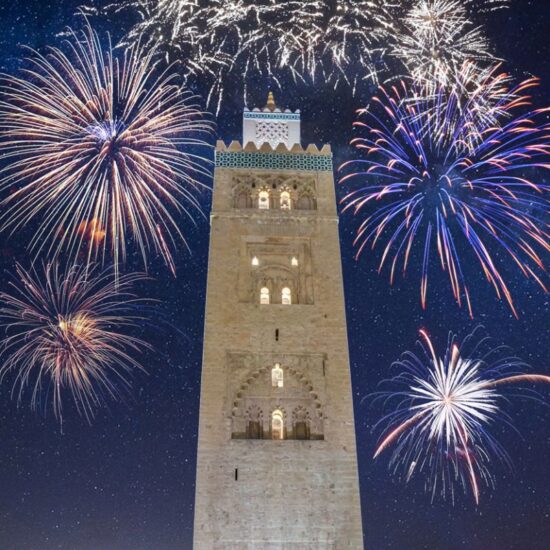 Koutoubia Mosque minaret in old medina with fireworks in Marrakesh, Morocco