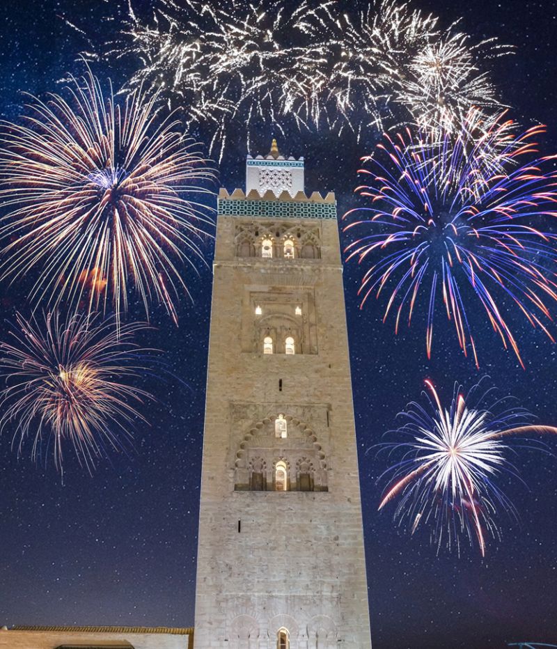 Koutoubia Mosque minaret in old medina with fireworks in Marrakesh, Morocco