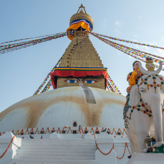 Local art statue in front of Boudhanath stupa the largest stupas in the world located in Kathmandu the capital city of Nepal.