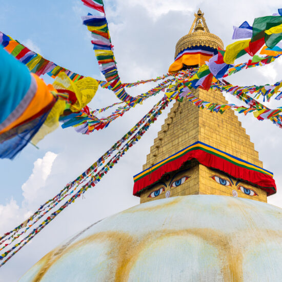 Boudhanath Stupa and prayer flags in Kathmandu, Nepal. Buddhist stupa of Boudha Stupa is one of the largest stupas in the world