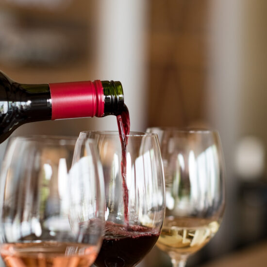 Pouring wine in glasses