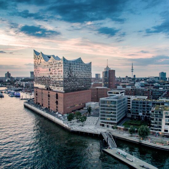 View Of Cityscape Against Cloudy Sky
