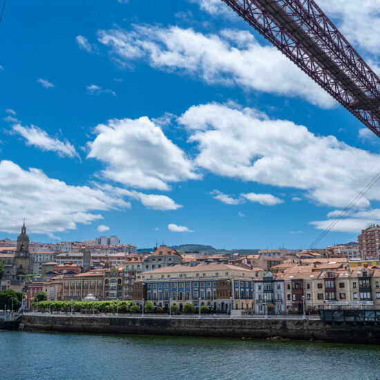 Vizcaya bridge crossing nervión river with portugalete city