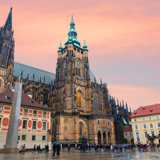 St. Vitus Cathedral at Prague Castle in Prague under a fantastic sunset. Tourists.