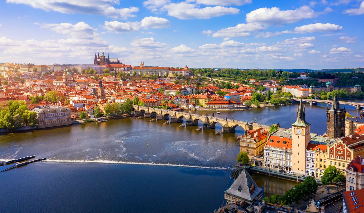 Scenic view of the Old Town pier architecture and Charles Bridge over Vltava river in Prague, Czech Republic. Prague iconic Charles Bridge (Karluv Most) and Old Town Bridge Tower at sunset, Czechia.