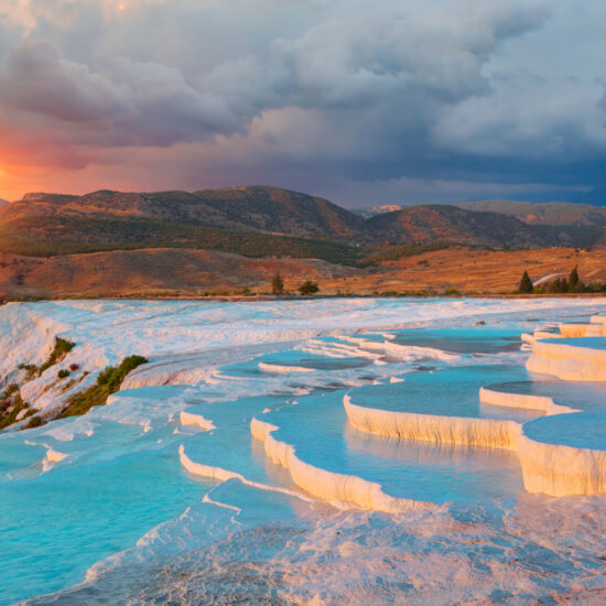 Natural travertine pools and terraces in Pamukkale at sunset Cotton castle in southwestern Turkey