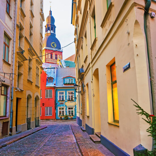 Narrow street leading to St. Peter church in Old Riga